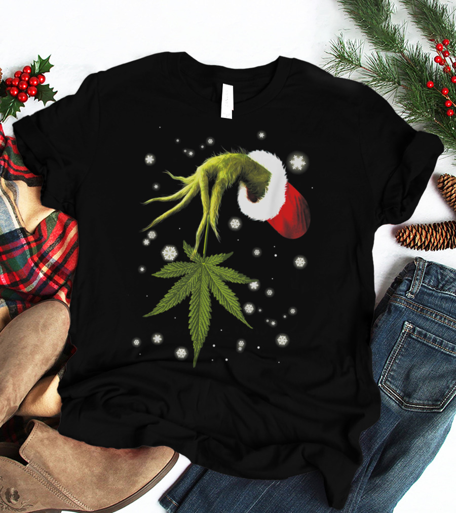 Grinch Hand Holding Cannabis Leaf With Santa Hat And Snowflakes T-Shirt