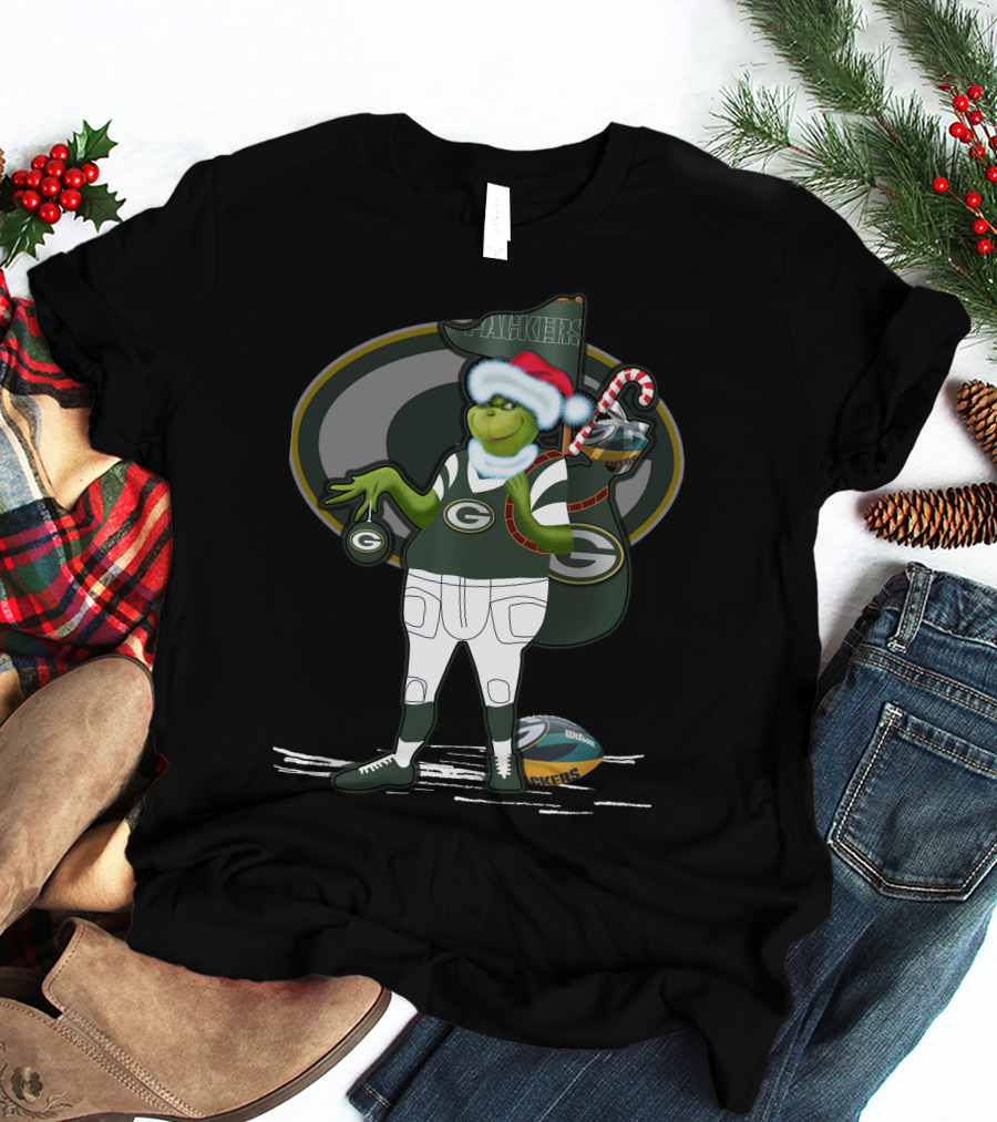 Grinchxmas Green Bay Packers Santa Hat Grinch Holding Helmet And Candy Cane T-Shirt