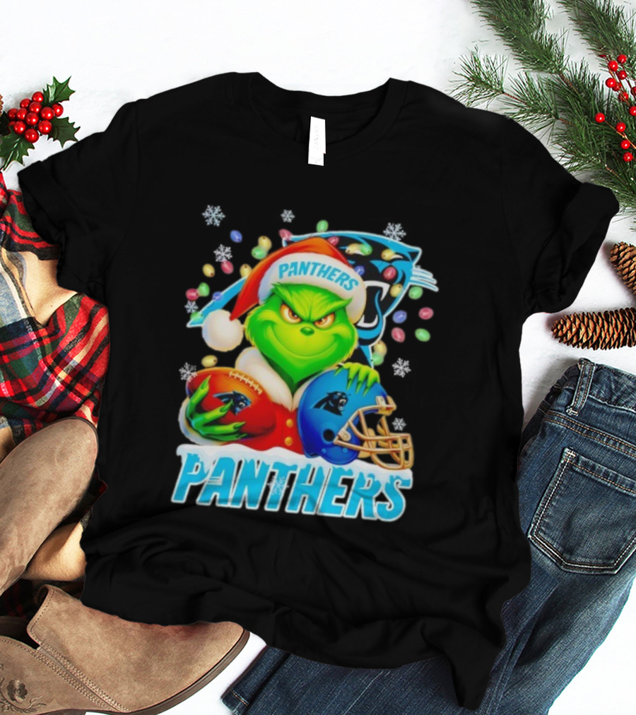 Grinch Santa Hat Holding Carolina Panthers Football And Helmet Merry Christmas T-Shirt