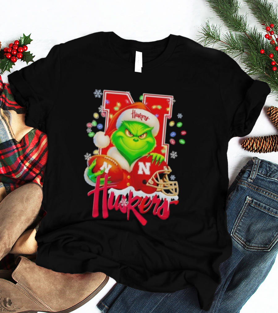 Grinch Santa With Nebraska Cornhuskers Helmet And Football Merry Christmas Huskers T-Shirt