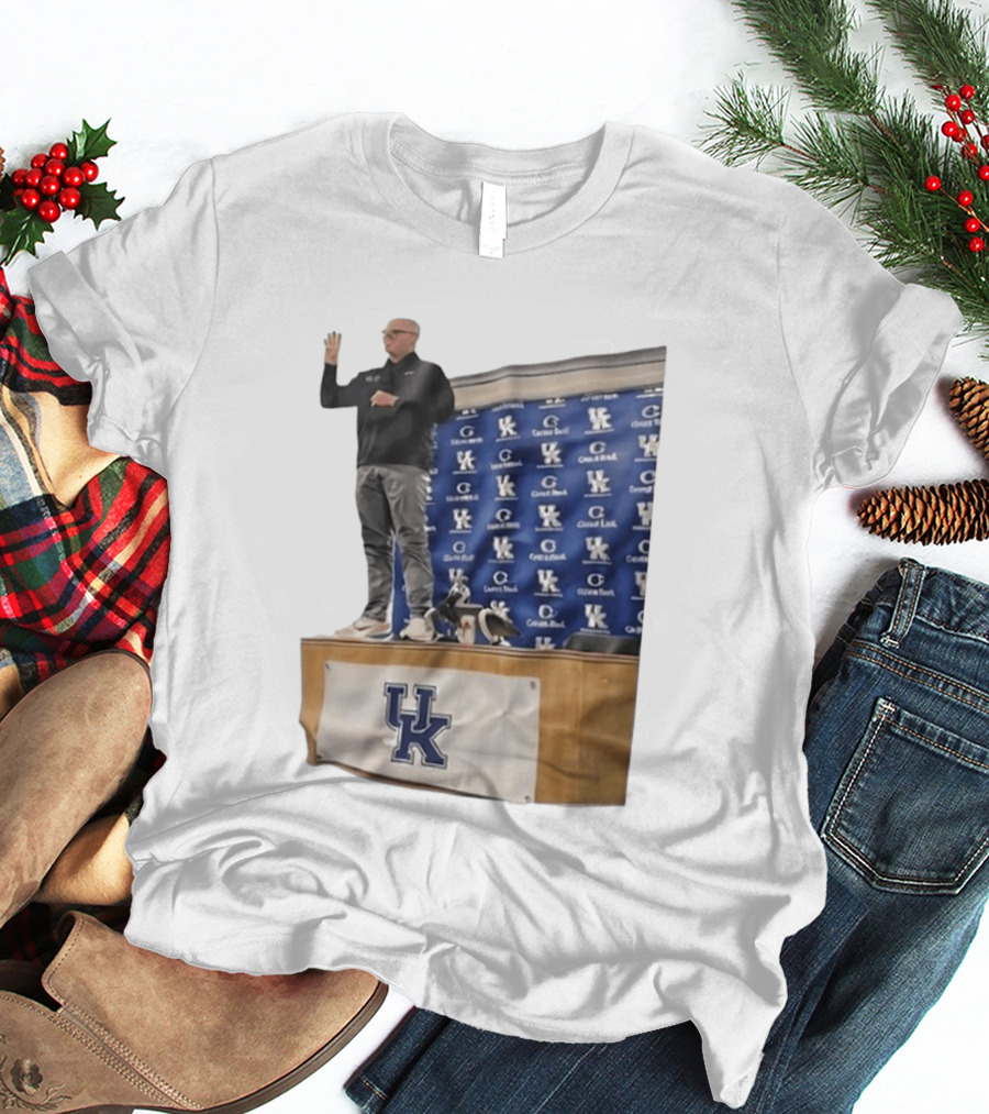 UK Volleyball Coach Craig Skinner Standing On Table With UK Logo And Awards T-Shirt