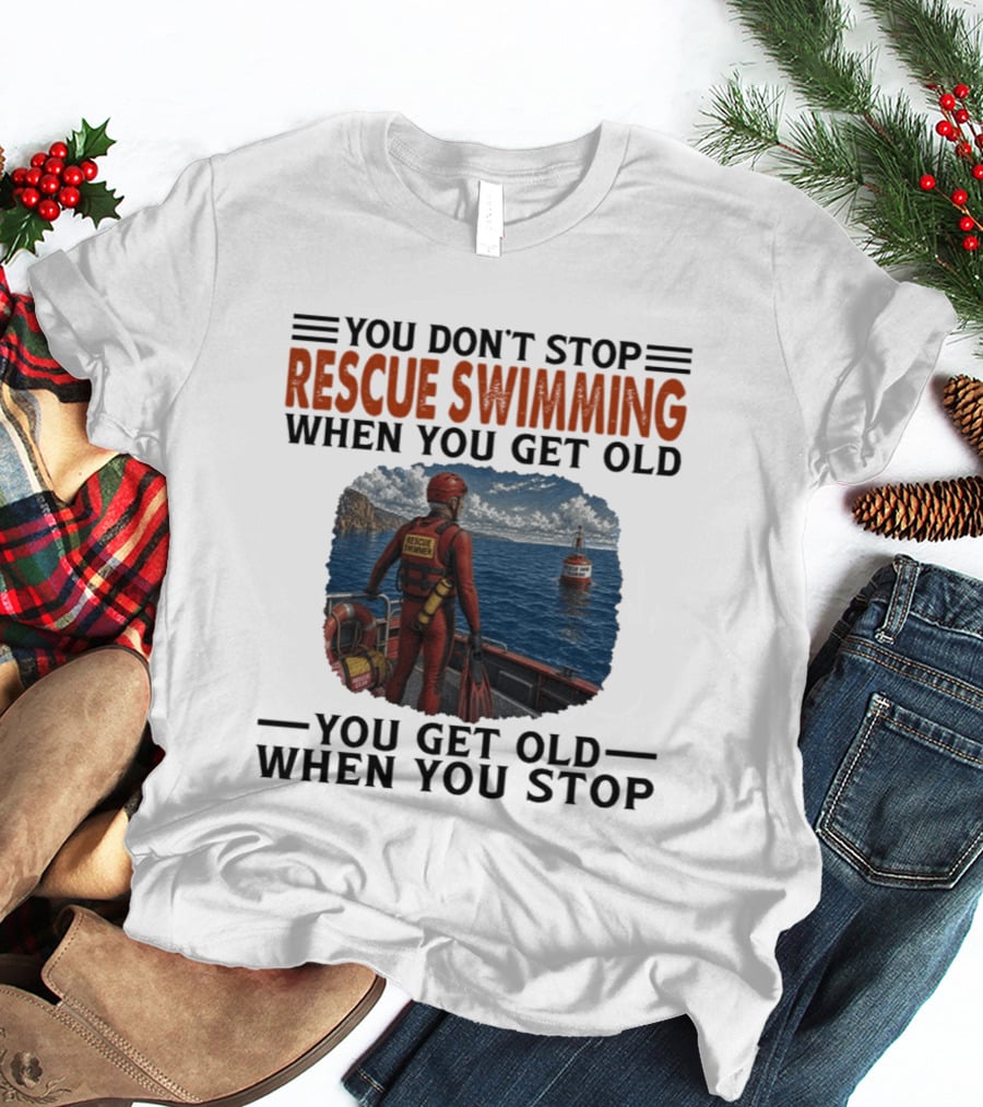 You Don't Stop Rescue Swimming When You Get Old You Get Old When You Stop Rescue Swimmer Standing On Boat Near Lighthouse T-Shirt