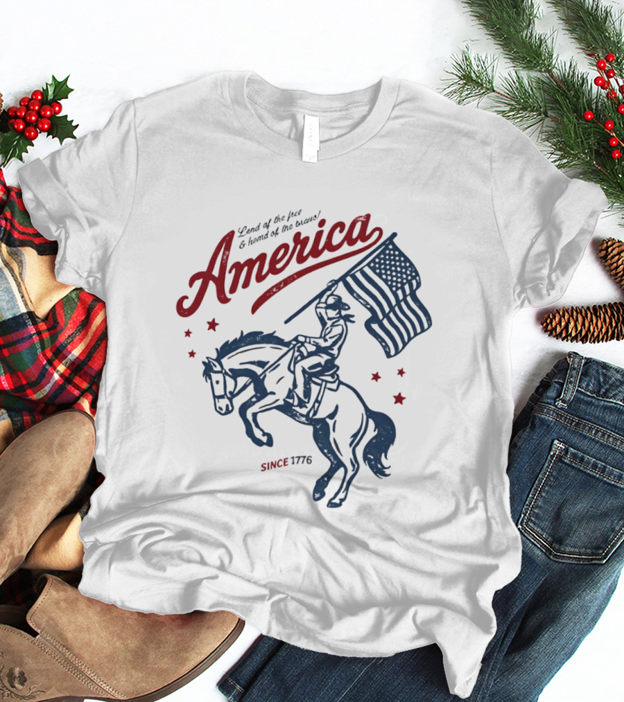America Land Of The Free Home Of The Brave Since 1776 Cowboy Holding Flag Patriotic T-Shirt