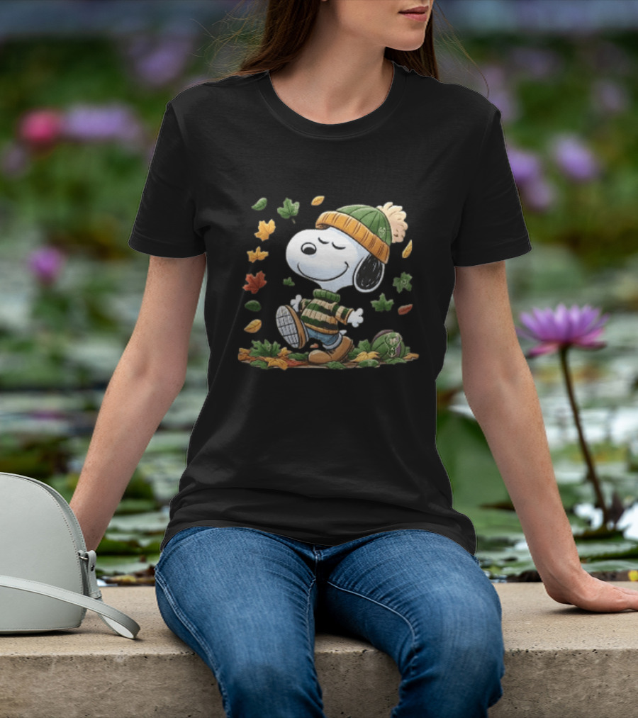 Milwaukee Bucks Snoopy In Beanie Walking Through Autumn Leaves Cartoon T-Shirt
