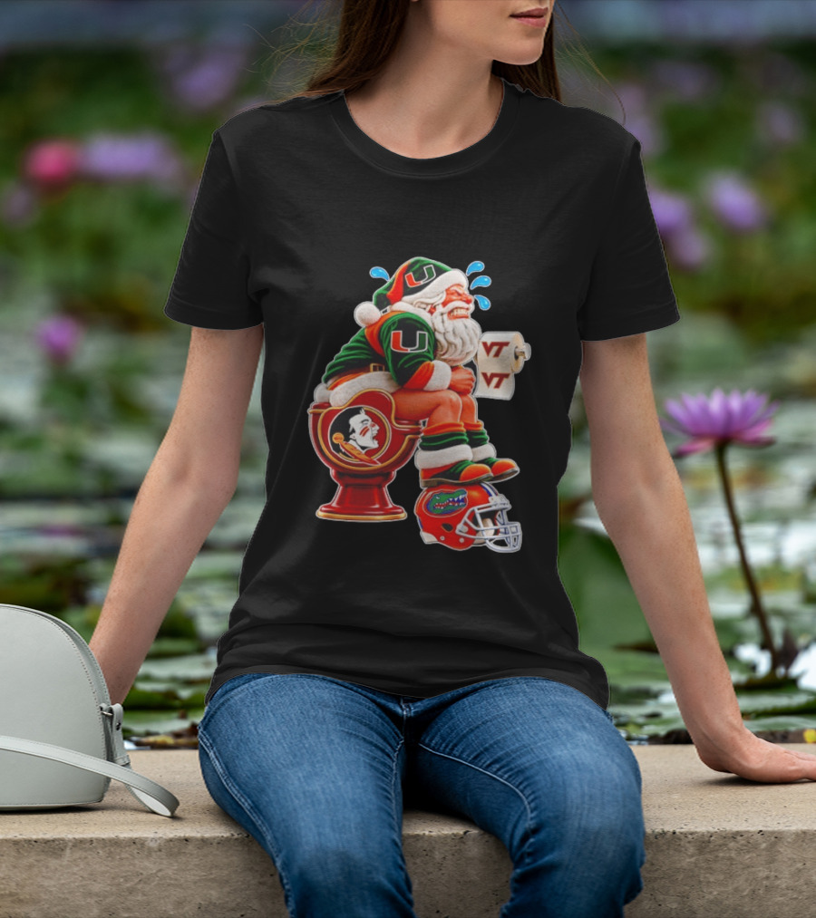 Miami Hurricanes Santa Claus Laughing On Florida State Toilet With Virginia Tech Toilet Paper And Florida Gators Helmet T-Shirt