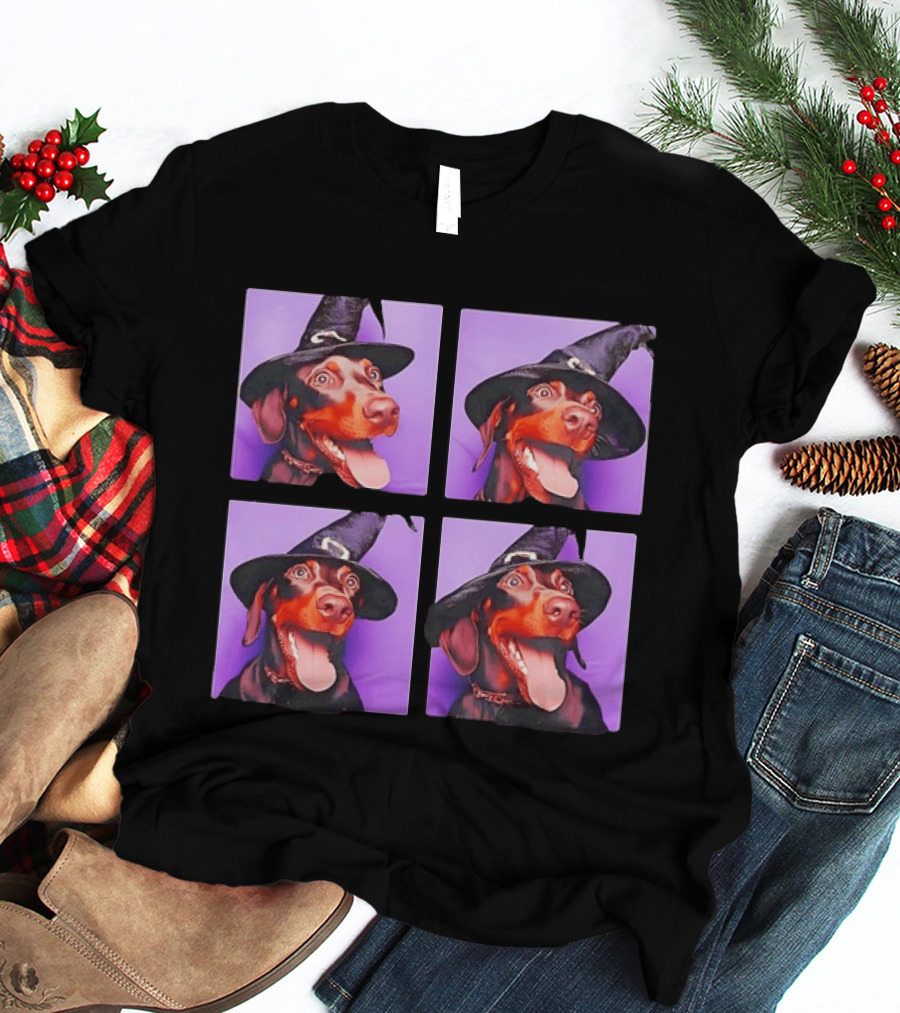 Doberman Pinscher In Witch Hat For Halloween With Purple T-Shirt