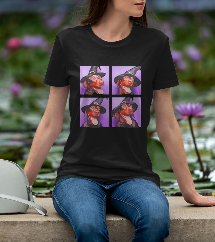 Doberman Pinscher In Witch Hat For Halloween With Purple T-Shirt