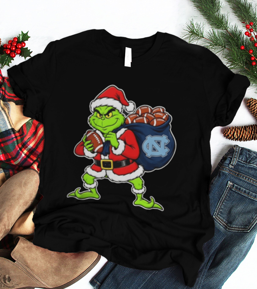 Grinch Santa North Carolina Tar Heels Holding Chiefs Footballs Christmas T-Shirt